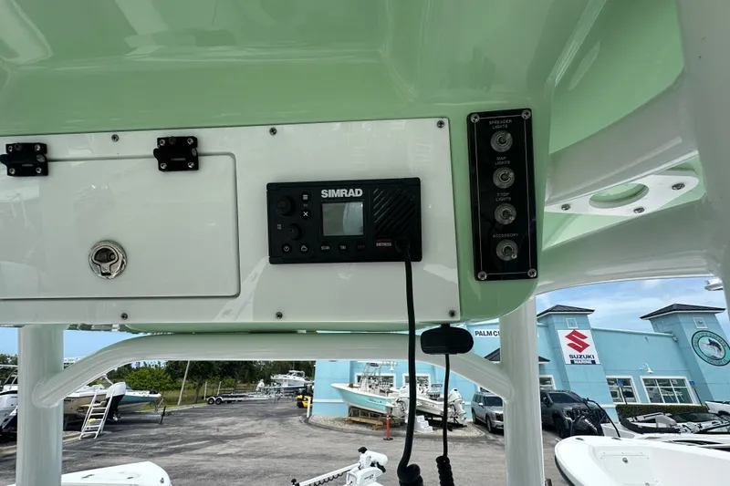 Slide: The Image of 2026 Sea Pro 230 Bay boat dashboard with Simrad electronics and control panel. - 6