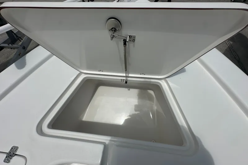 Slide: The Image of Open storage compartment on 2026 Sea Pro 230 Bay boat. - 9