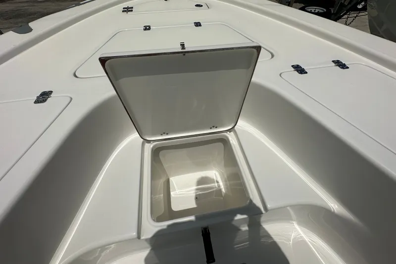 Slide: The Image of 2026 Sea Pro 230 Bay boat storage compartment with open hatch. - 12