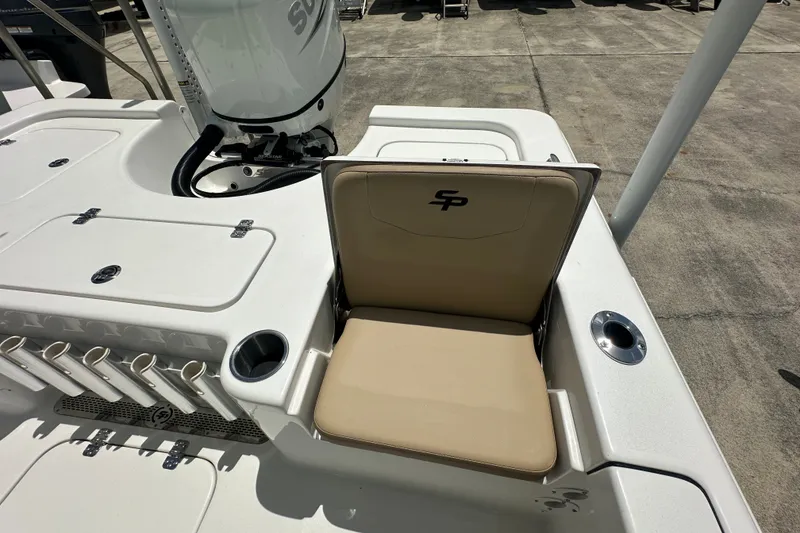 Slide: The Image of 2026 Sea Pro 230 Bay boat with beige seating and rod holders. - 16