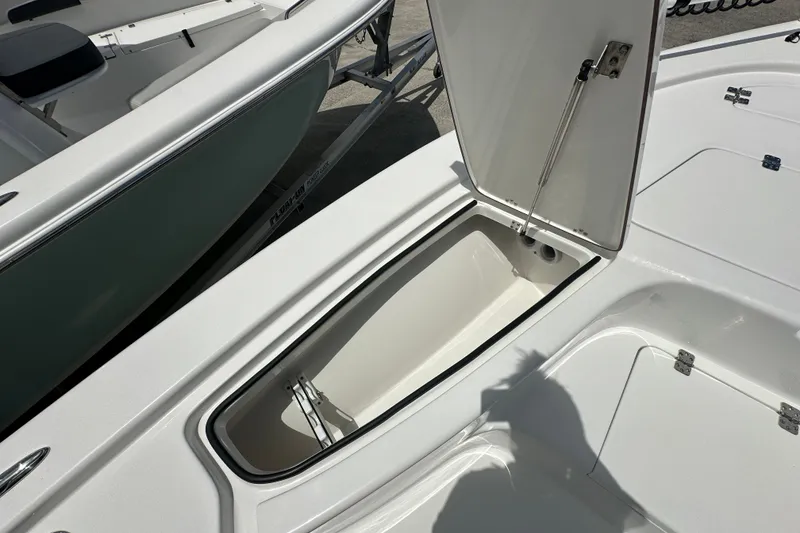 Slide: The Image of Open storage compartment on 2026 Sea Pro 230 Bay boat, showcasing interior space. - 11