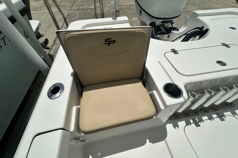 Slide: The Image of 2026 Sea Pro 230 Bay boat seat with cup holders and rod storage. - 18