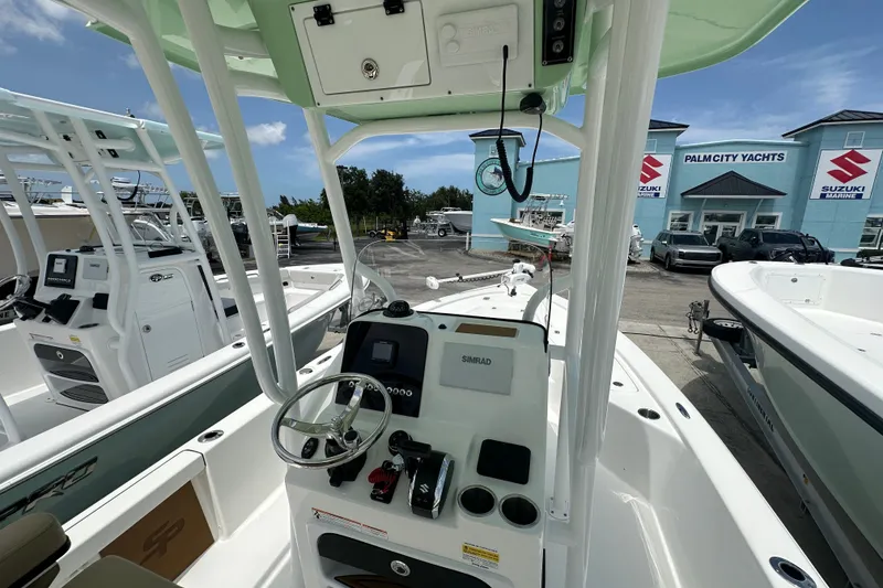 Slide: The Image of 2026 Sea Pro 230 Bay boat interior at Palm City Yachts dealership. - 4