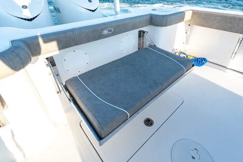 Slide: The Image of 2026 Sea Hunt Gamefish 30CB boat with cushioned seating and dual engines. - 31