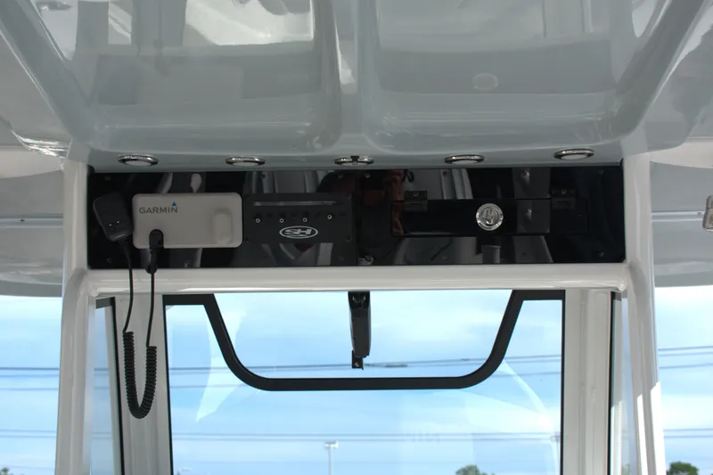 Slide: The Image of 2026 Sea Hunt Gamefish 30CB boat dashboard with Garmin device and sleek design. - 8