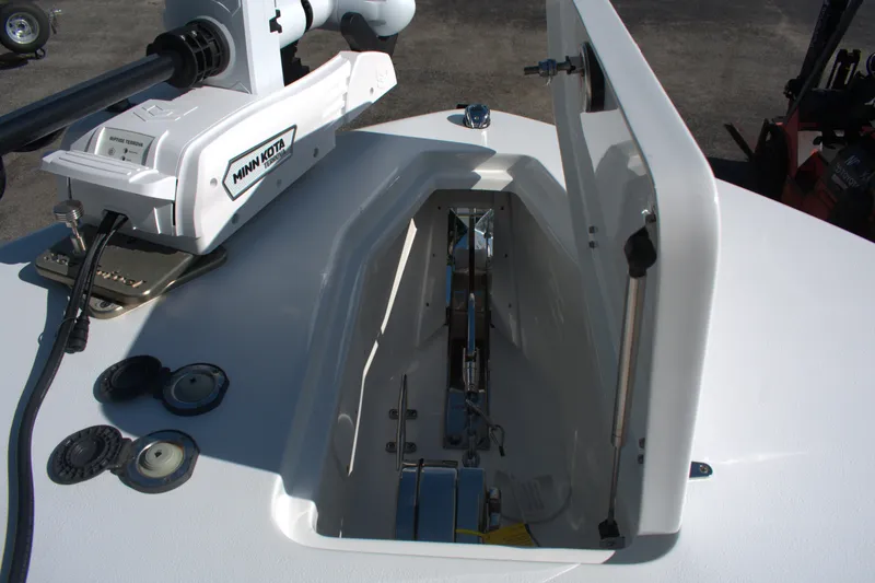 Slide: The Image of Anchor compartment of 2026 Sea Hunt Gamefish 30CB with Minn Kota trolling motor. - 11
