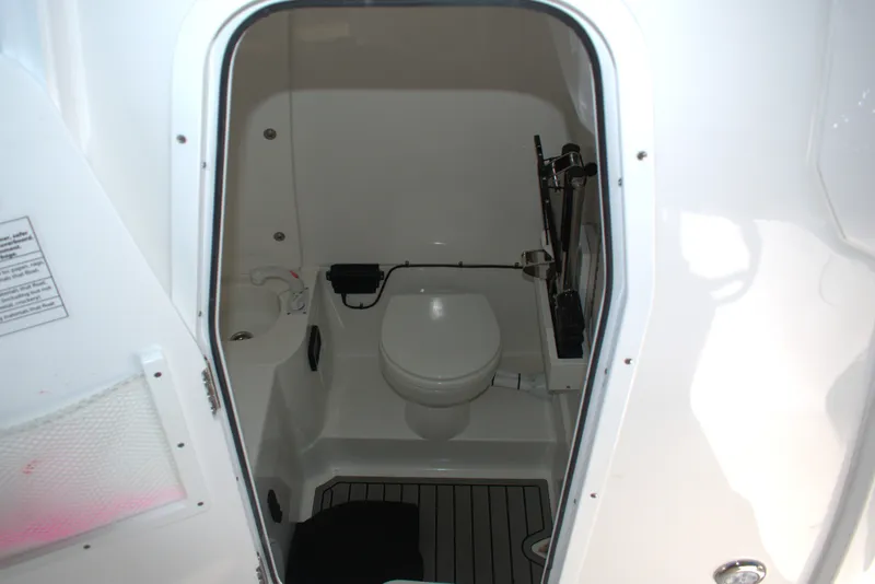 Slide: The Image of Interior view of 2026 Sea Hunt Gamefish 30CB boat bathroom. - 13