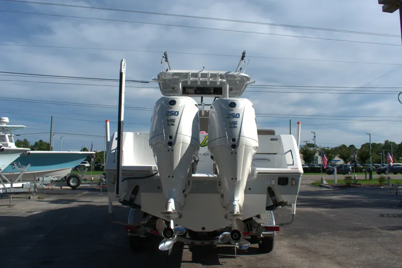 Slide: The Image of 2026 Sea Hunt Gamefish 30CB boat with twin 350 V6 engines, rear view. - 3