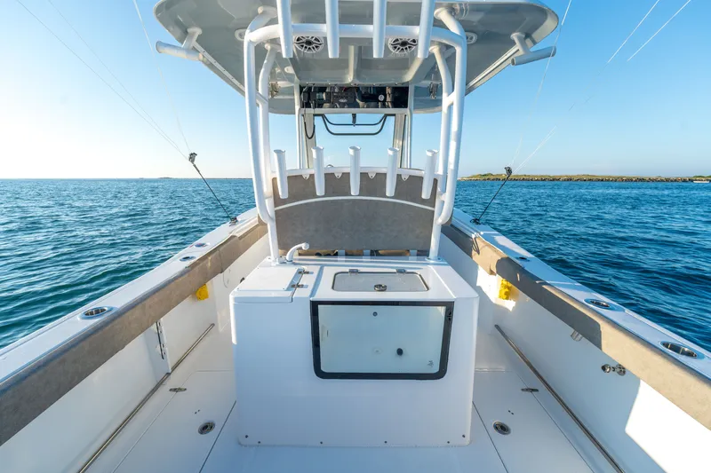 Slide: The Image of 2026 Sea Hunt Gamefish 30CB boat on open water, featuring spacious deck and fishing equipment. - 23