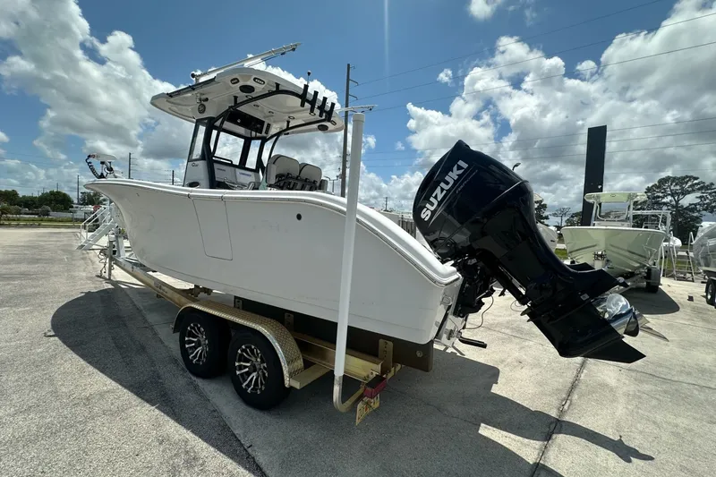 Slide: The Image of 2024 Sea Pro 262 Center Console boat on trailer with Suzuki outboard motor. - 5