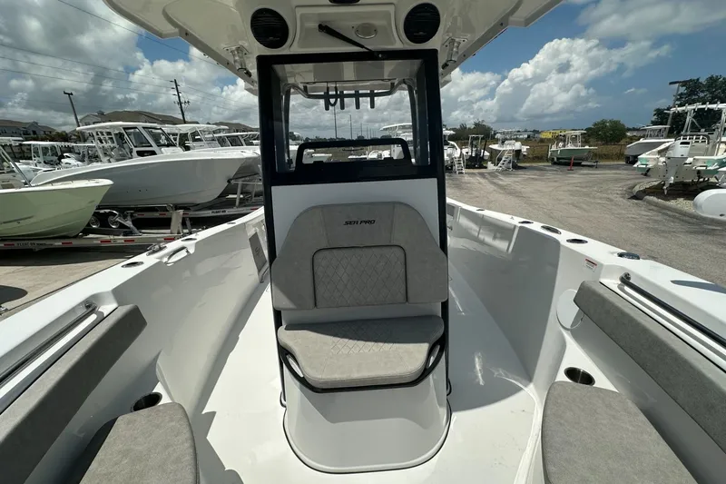 Slide: The Image of 2024 Sea Pro 262 Center Console boat interior with seating and console view. - 10