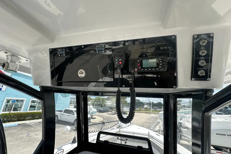 Slide: The Image of 2024 Sea Pro 262 Center Console dashboard with radio and control panel. - 8