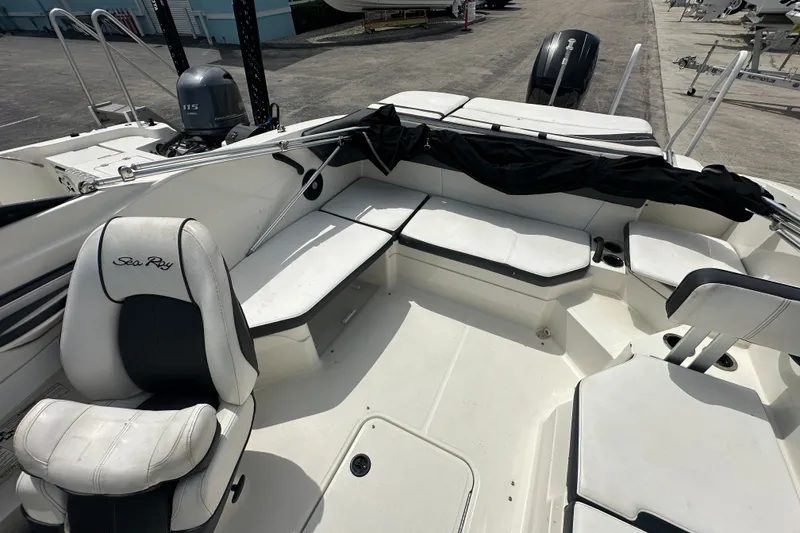 Slide: The Image of 2015 Sea Ray 21 SPX OB boat interior with seating and outboard motor. - 10