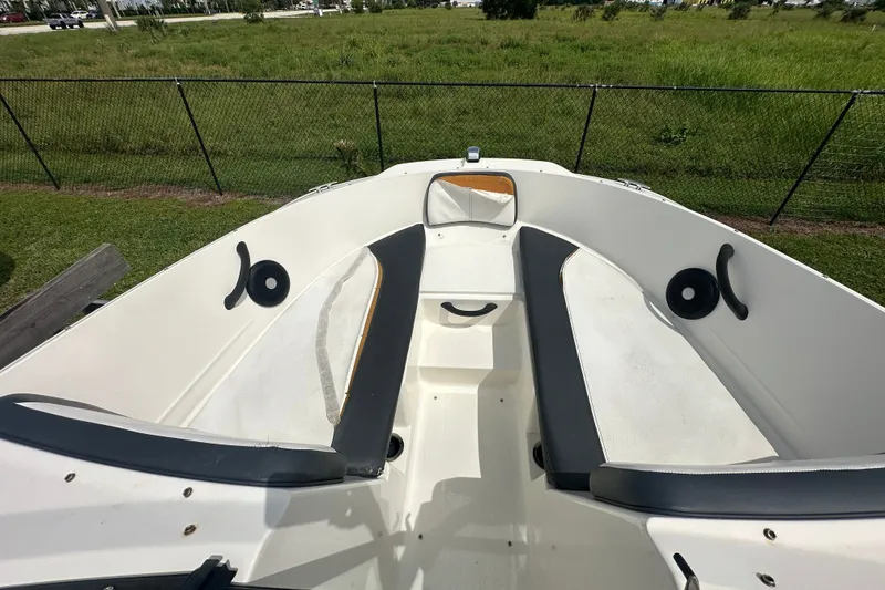 Slide: The Image of 2015 Sea Ray 21 SPX OB boat interior with seating and open deck. - 8