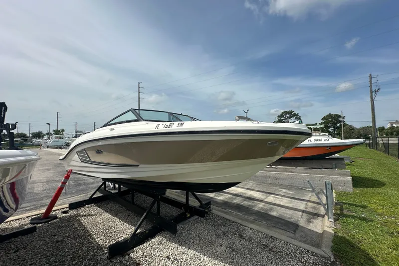 Slide: The Image of 2015 Sea Ray 21 SPX OB boat on display in outdoor setting. - 2