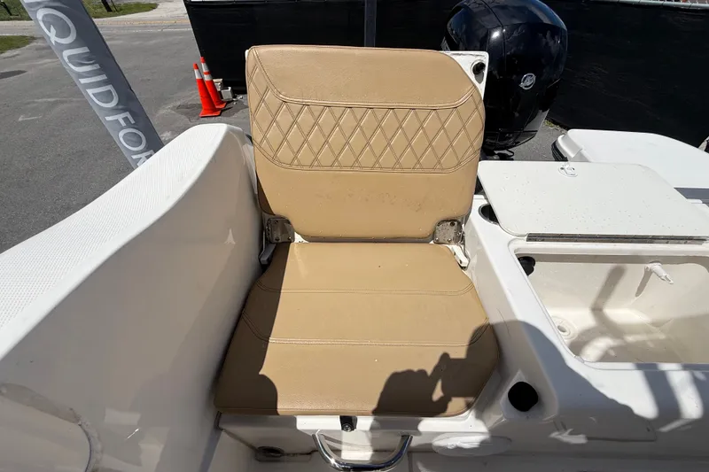 Slide: The Image of 2024 Bayliner Trophy T22CC boat seat with tan upholstery and diamond stitching. - 59
