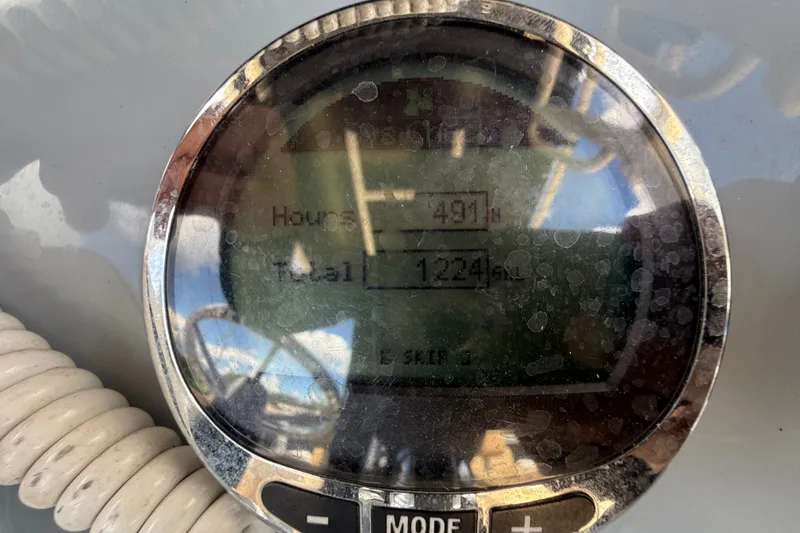 Slide: The Image of Close-up of a Bayliner Trophy T22CC 2024 hour meter displaying 491 hours. - 27