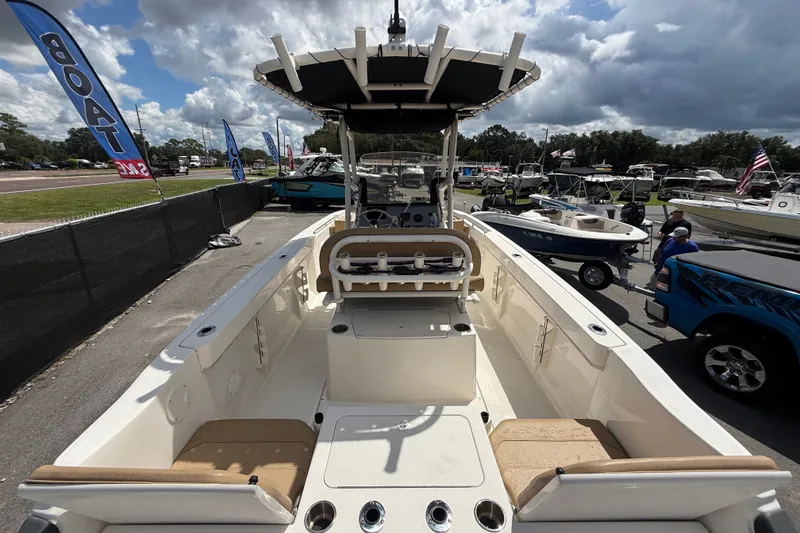 Slide: The Image of 2024 Bayliner Trophy T22CC boat on display at outdoor boat show. - 17