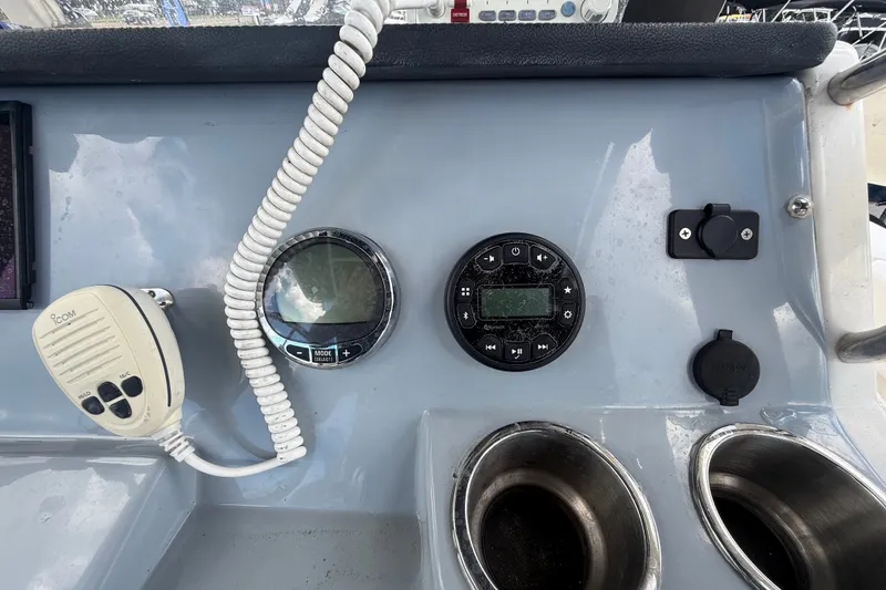 Slide: The Image of Control panel of 2024 Bayliner Trophy T22CC boat with radio and gauges. - 25