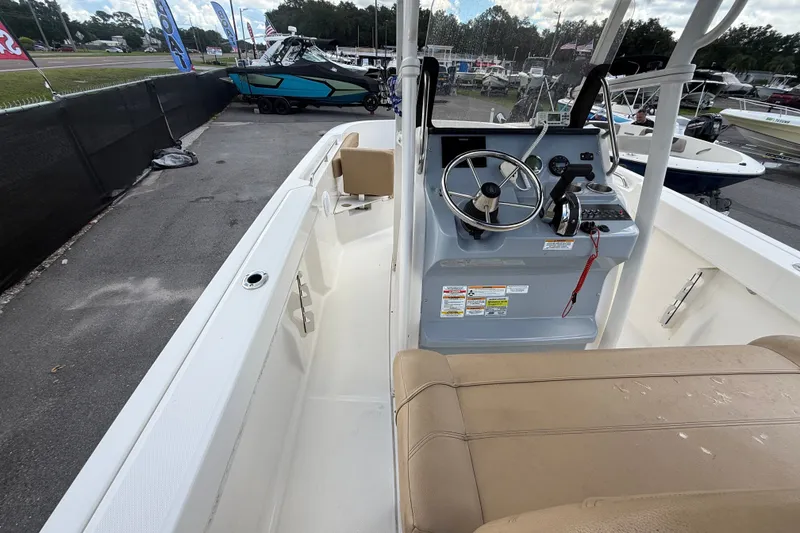 Slide: The Image of 2024 Bayliner Trophy T22CC boat interior with steering console and seating. - 29