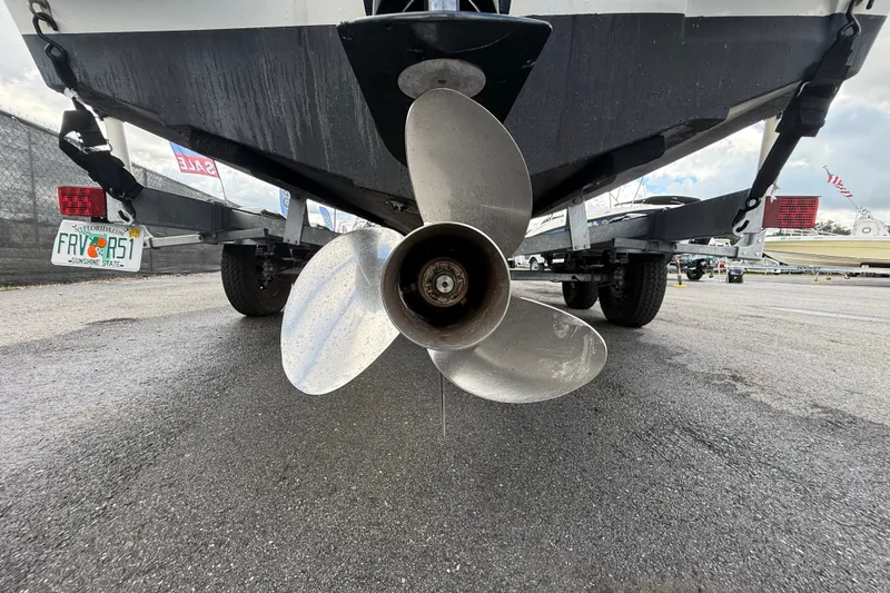 Slide: The Image of 2024 Bayliner Trophy T22CC boat propeller on trailer, close-up view. - 6
