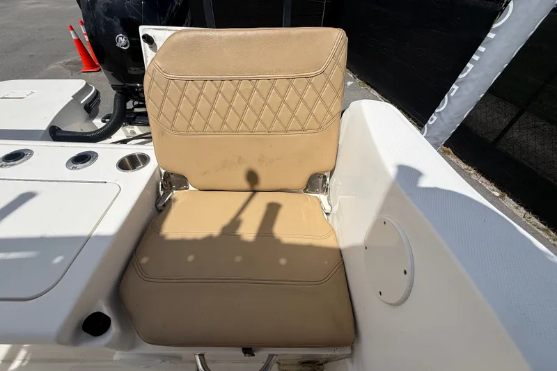 Slide: The Image of 2024 Bayliner Trophy T22CC boat seat with tan upholstery and diamond stitching. - 62