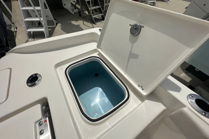 Slide: The Image of Open storage compartment on 2027 Avenger AV26 boat, featuring sleek design and functionality. - 20