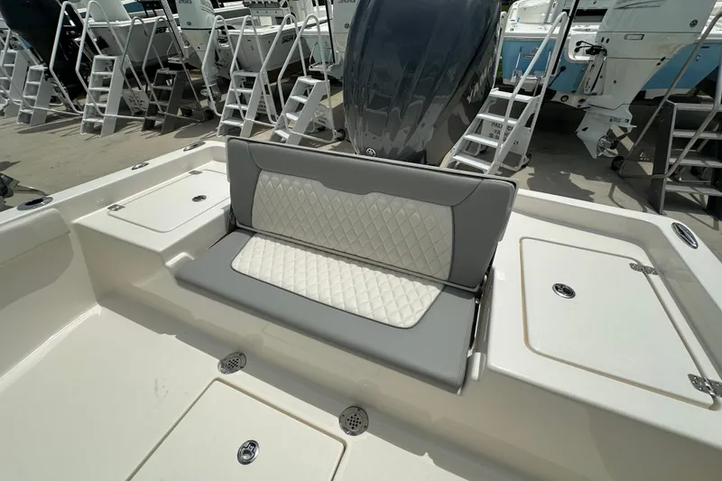 Slide: The Image of Avenger AV26 2027 boat interior with cushioned seating and storage compartments. - 19