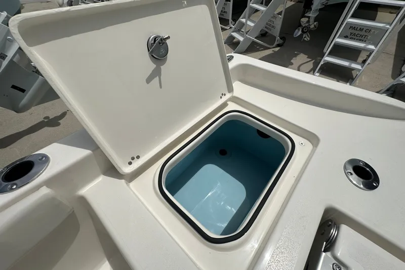 Slide: The Image of Open storage compartment on 2027 Avenger AV26 boat deck. - 21
