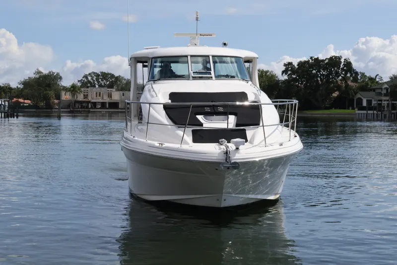 Slide: The Image of 2006 Sea Ray 40 Motor Yacht cruising on calm waters, front view. - 8