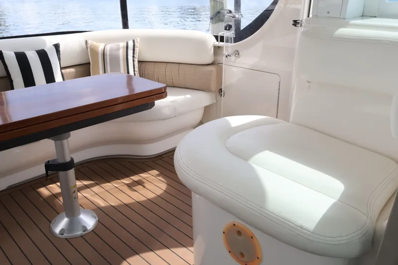 Slide: The Image of Luxurious interior of 2006 Sea Ray 40 Motor Yacht with elegant seating and wooden table. - 19