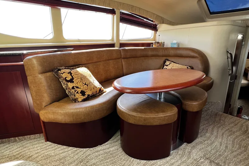 Slide: The Image of Luxurious interior of 2006 Sea Ray 40 Motor Yacht with elegant seating and table. - 38