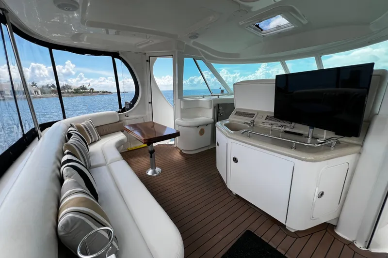 Slide: The Image of Luxurious interior of a 2006 Sea Ray 40 Motor Yacht with elegant seating and scenic views. - 14