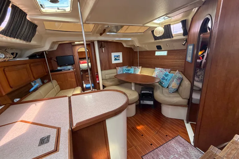 Slide: The Image of Interior of 1992 Hunter Legend 43 sailboat with cozy seating and wooden finishes. - 31
