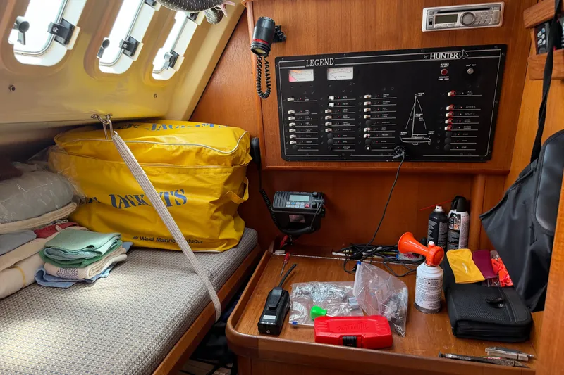 Slide: The Image of Interior of 1992 Hunter Legend 43 sailboat with control panel and safety equipment. - 49