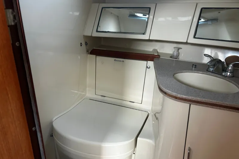 Slide: The Image of Bathroom interior of 1992 Hunter Legend 43 yacht with sink and mirrors. - 18