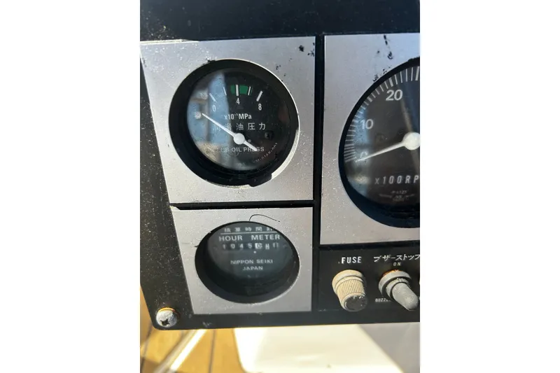 Slide: The Image of Close-up of 1992 Hunter Legend 43 boat gauges and controls. - 29