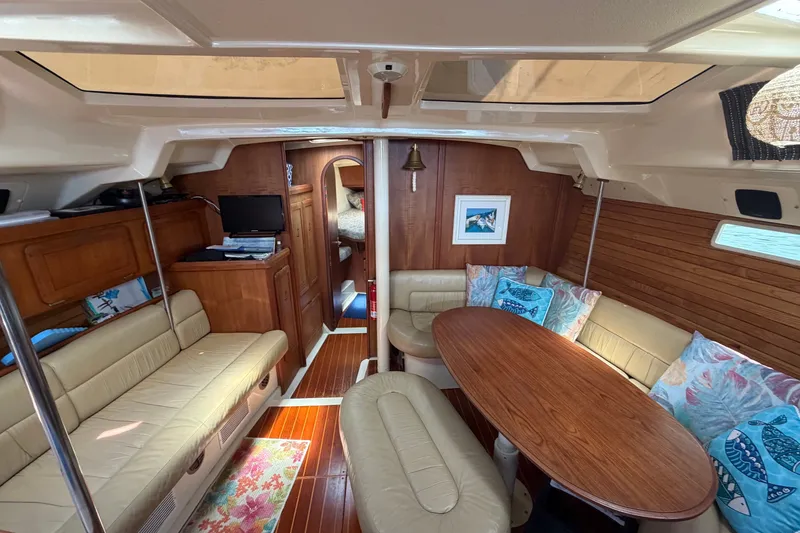 Slide: The Image of Interior of 1992 Hunter Legend 43 yacht with cozy seating and wooden accents. - 35