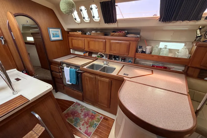 Slide: The Image of Interior of 1992 Hunter Legend 43 yacht kitchen with wooden cabinetry and sink. - 36