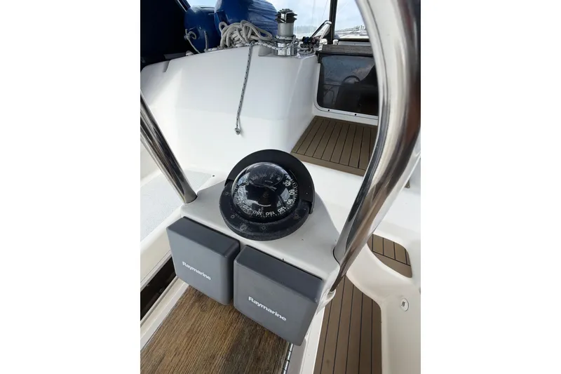 Slide: The Image of Cockpit of 1992 Hunter Legend 43 sailboat with compass and Raymarine equipment. - 21