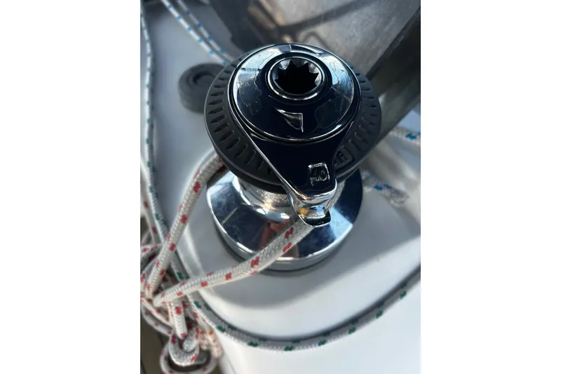 Slide: The Image of Winch on 1992 Hunter Legend 43 sailboat with ropes coiled around it. - 24