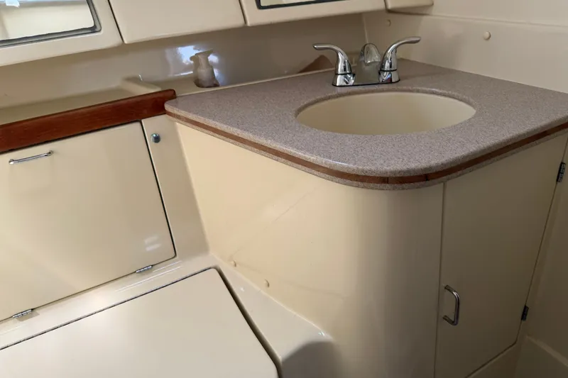 Slide: The Image of Interior of 1992 Hunter Legend 43 yacht bathroom with sink and storage cabinets. - 53