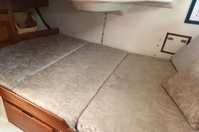 Slide: The Image of Interior cabin of 1992 Hunter Legend 43 sailboat with cushioned bed. - 54