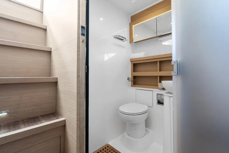 Slide: The Image of Modern bathroom interior on 2021 Aquila 54 Yacht, featuring sleek design and wooden accents. - 32
