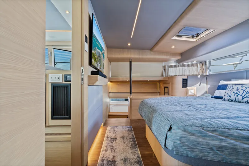 Slide: The Image of Luxurious interior of 2021 Aquila 54 Yacht featuring a cozy bedroom and modern amenities. - 17