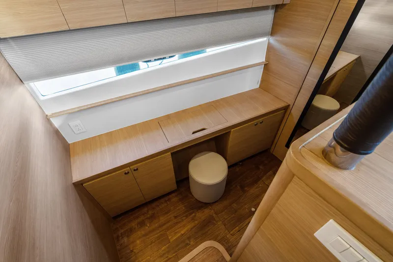 Slide: The Image of Interior of 2021 Aquila 54 Yacht featuring sleek wooden cabinetry and modern design. - 21