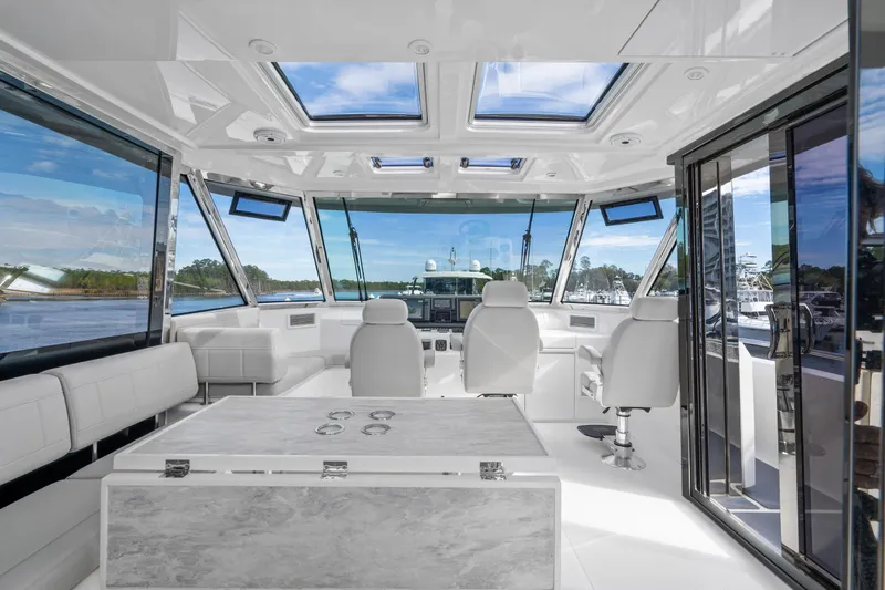Slide: The Image of Luxurious interior of 2021 Aquila 54 Yacht with panoramic windows and modern seating. - 42