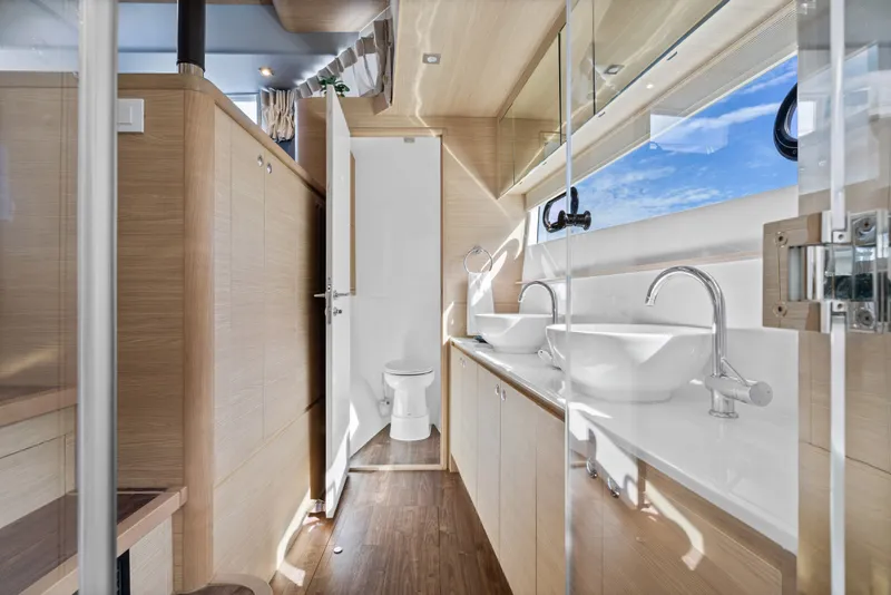 Slide: The Image of Luxurious bathroom interior of 2021 Aquila 54 Yacht with dual sinks and modern design. - 18
