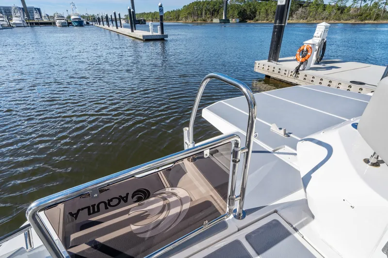 Slide: The Image of Aquila 54 Yacht 2021 at marina dock, featuring sleek design and spacious deck. - 47