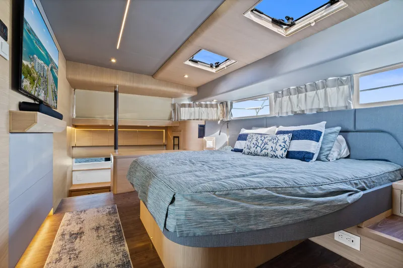 Slide: The Image of Luxurious interior of 2021 Aquila 54 Yacht with spacious bed and modern decor. - 16